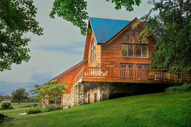 W6887 Two Mile Rd, Porterfield, WI 54159 - rear view of property with a deck, a yard, stone siding, and log siding