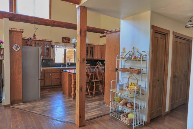 W6887 Two Mile Rd, Porterfield, WI 54159 - kitchen with freestanding refrigerator, brown cabinets, a sink, and dark wood-style flooring