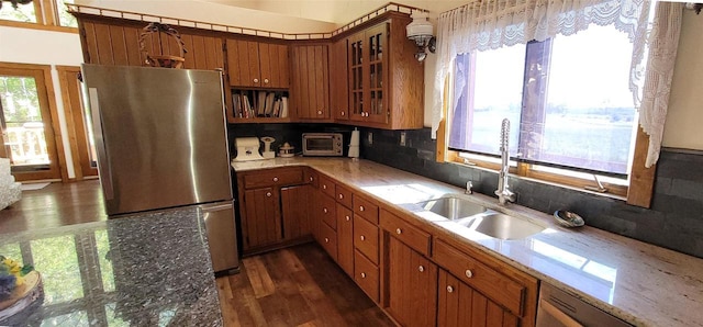 W6887 Two Mile Rd, Porterfield, WI 54159 - kitchen featuring freestanding refrigerator, a sink, brown cabinetry, dishwashing machine, and dark wood-style flooring