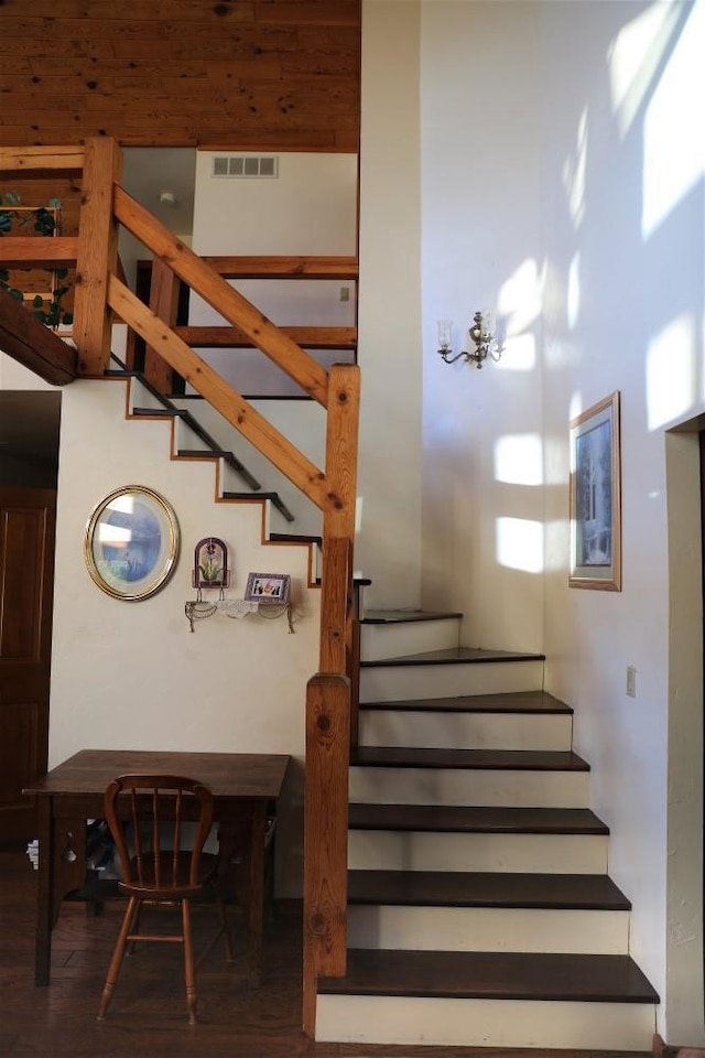 W6887 Two Mile Rd, Porterfield, WI 54159 - staircase featuring wood finished floors and a chandelier