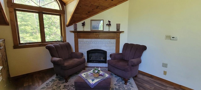 W6887 Two Mile Rd, Porterfield, WI 54159 - living area with lofted ceiling, wood finished floors, baseboards, a tile fireplace, and wooden ceiling