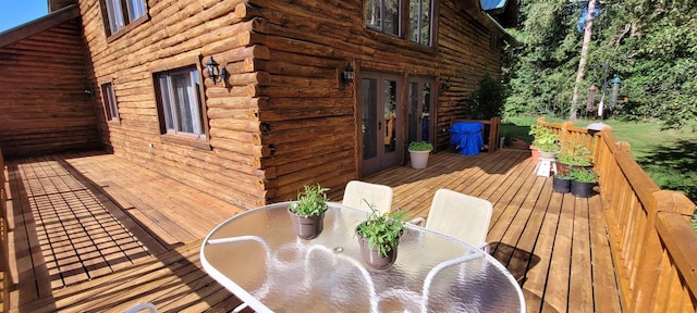 W6887 Two Mile Rd, Porterfield, WI 54159 - wooden terrace with french doors and outdoor dining area