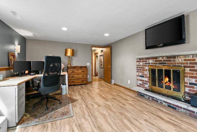 4917 Ralph Cir, Madison, WI 53714 - home office featuring a brick fireplace, light wood-type flooring, recessed lighting, and baseboards