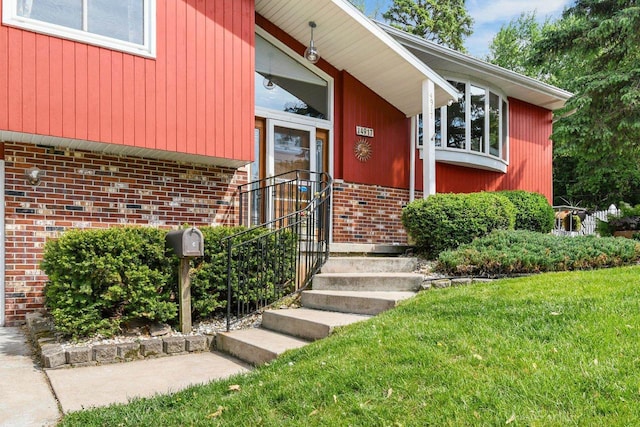 4917 Ralph Cir, Madison, WI 53714 - view of exterior entry with brick siding and a yard