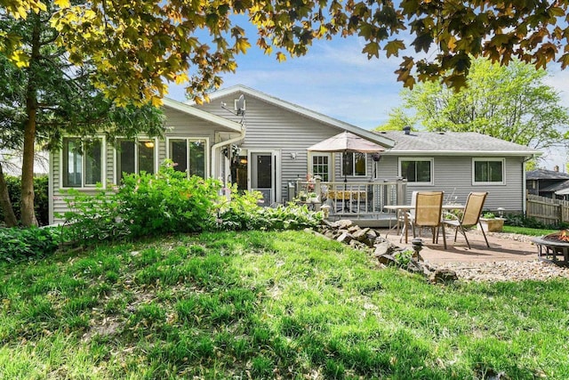 4917 Ralph Cir, Madison, WI 53714 - back of property featuring a fire pit, outdoor dining area, and a patio area