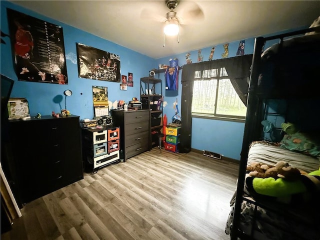 1051 E Chippewa Ave, Bruce, WI 54819 - bedroom with wood finished floors, baseboards, and a ceiling fan