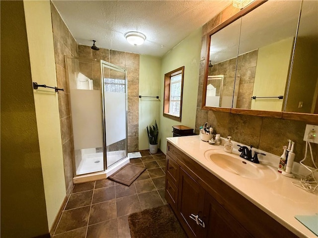 1051 E Chippewa Ave, Bruce, WI 54819 - bathroom with a shower stall, vanity, a textured ceiling, tile patterned flooring, and baseboards
