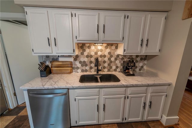 14 Chippewa St, Chippewa Falls, WI 54729 - kitchen featuring dishwasher, a sink, white cabinets, tasteful backsplash, and light stone counters