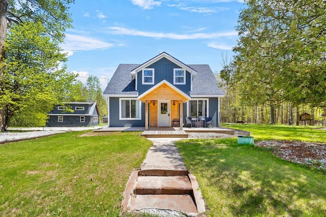 8606 State Highway 57, Baileys Harbor, WI 54202 - bungalow-style house featuring a front lawn and covered porch