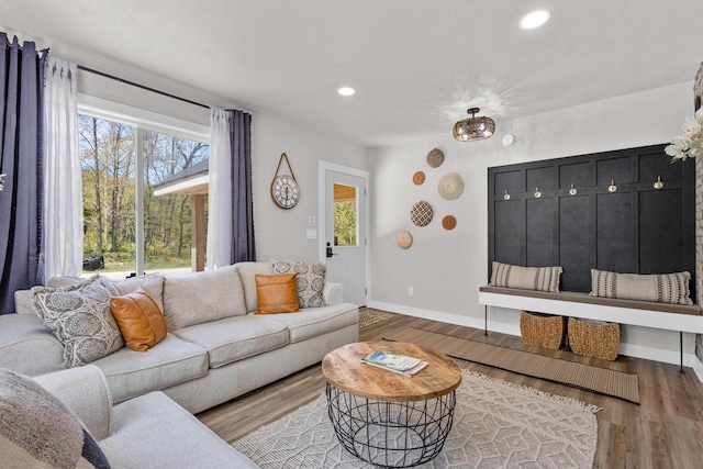 8606 State Highway 57, Baileys Harbor, WI 54202 - living room with wood finished floors, baseboards, and recessed lighting