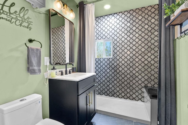 8606 State Highway 57, Baileys Harbor, WI 54202 - bathroom with toilet, vanity, a shower with shower curtain, and tile patterned floors