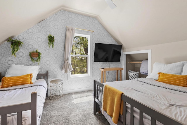 8606 State Highway 57, Baileys Harbor, WI 54202 - bedroom with wallpapered walls, carpet flooring, lofted ceiling, and ceiling fan