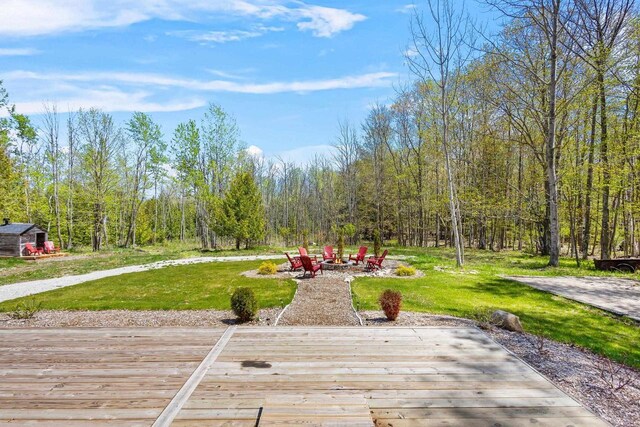 8606 State Highway 57, Baileys Harbor, WI 54202 - wooden terrace featuring a fire pit and a lawn