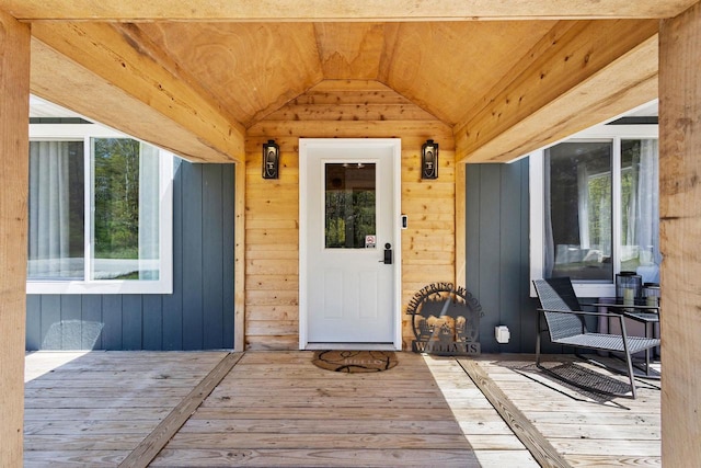 8606 State Highway 57, Baileys Harbor, WI 54202 - property entrance featuring a wooden deck and board and batten siding