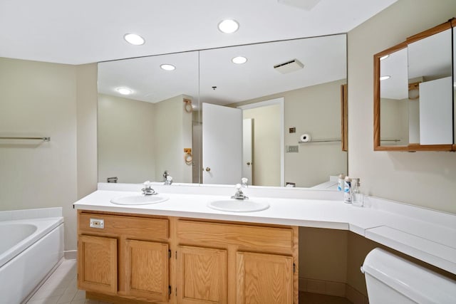 333 Lake Ave Unit 502, Racine, WI 53403 - full bathroom featuring toilet, double vanity, a garden tub, tile patterned flooring, and recessed lighting