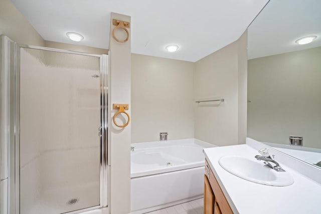 333 Lake Ave Unit 502, Racine, WI 53403 - bathroom featuring vanity, a shower stall, a whirlpool tub, and tile patterned floors