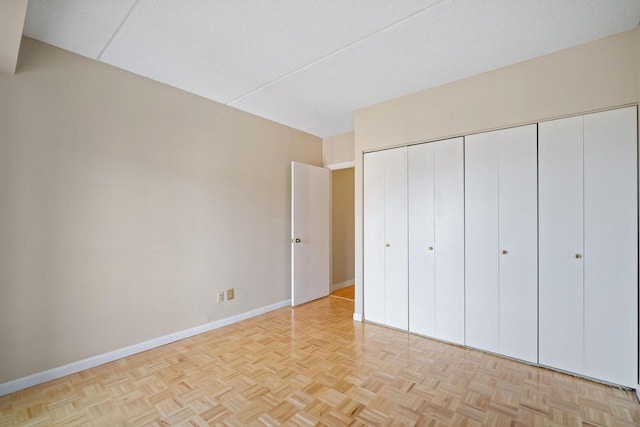333 Lake Ave Unit 502, Racine, WI 53403 - unfurnished bedroom with baseboards and a closet