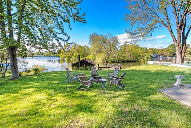 302 River Hts, Shawano, WI 54166 - view of grassy yard with a water view and a fire pit