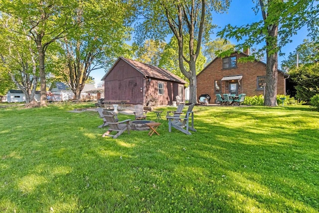302 River Hts, Shawano, WI 54166 - view of grassy yard featuring a fire pit and an outbuilding