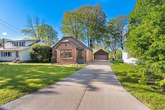 302 River Hts, Shawano, WI 54166 - bungalow-style house featuring brick siding, a detached garage, an outdoor structure, and a front yard