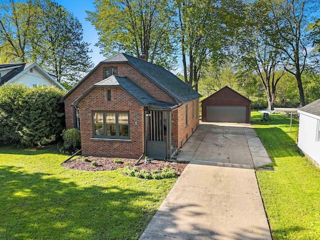 302 River Hts, Shawano, WI 54166 - view of front facade featuring brick siding, an outbuilding, a detached garage, and a front lawn