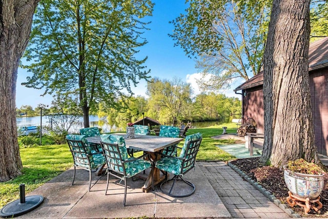 302 River Hts, Shawano, WI 54166 - view of patio / terrace with outdoor dining area and a water view
