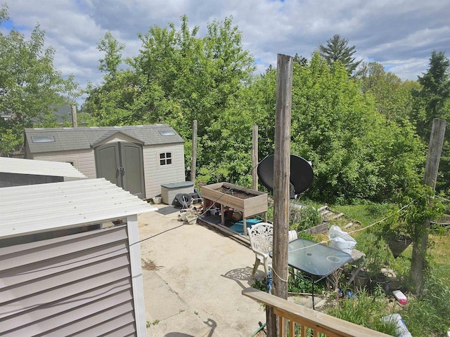 201 Center St, Elroy, WI 53929 - view of patio / terrace with view of wooded area