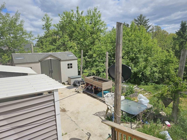 201 Center St, Elroy, WI 53929 - view of patio featuring view of wooded area