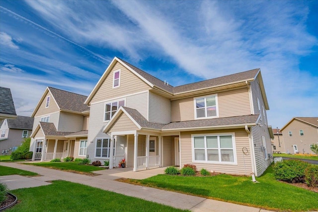 252 S Musket Ridge Dr Unit 2, Sun Prairie, WI 53590 - view of front of property with a porch and a front yard
