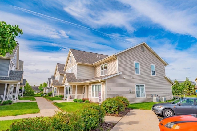 252 S Musket Ridge Dr Unit 2, Sun Prairie, WI 53590 - view of home's exterior featuring a lawn and covered porch