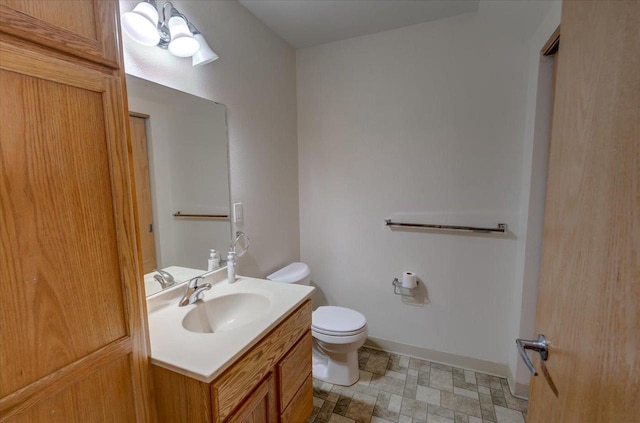 252 S Musket Ridge Dr Unit 2, Sun Prairie, WI 53590 - half bath featuring toilet, vanity, and baseboards