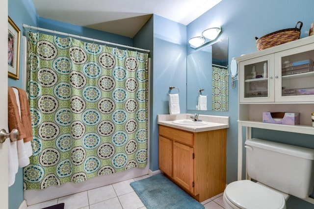 127 S Franklin St Unit 10, Madison, WI 53703 - bathroom with toilet, vanity, tile patterned flooring, and a shower with shower curtain