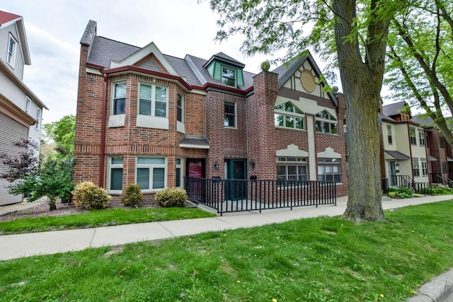 127 S Franklin St Unit 10, Madison, WI 53703 - view of property with brick siding and a front yard
