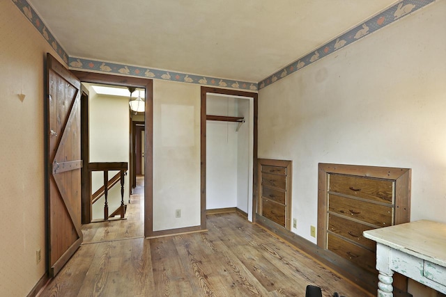 10317 195th Ave, Bristol, WI 53104 - unfurnished bedroom featuring wood finished floors, a closet, and baseboards