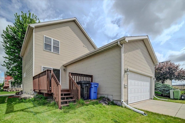 9305 Briar Haven Dr, Verona, WI 53593 - rear view of house with an attached garage, a yard, and a wooden deck