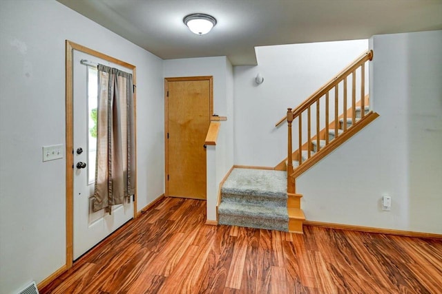 9305 Briar Haven Dr, Verona, WI 53593 - entryway with wood finished floors, stairway, and baseboards