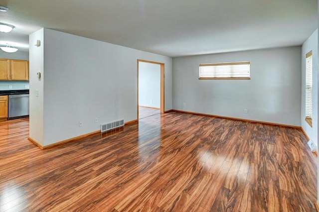 9305 Briar Haven Dr, Verona, WI 53593 - empty room featuring dark wood-type flooring and baseboards
