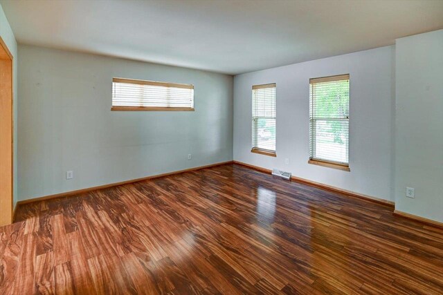 9305 Briar Haven Dr, Verona, WI 53593 - spare room with wood finished floors and baseboards