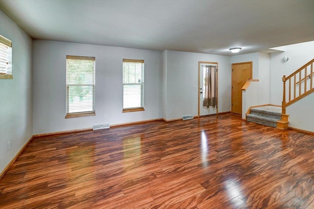 9305 Briar Haven Dr, Verona, WI 53593 - empty room with wood finished floors, stairs, and baseboards