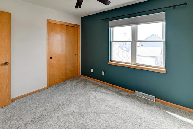 9305 Briar Haven Dr, Verona, WI 53593 - unfurnished bedroom featuring carpet flooring, a closet, baseboards, and ceiling fan