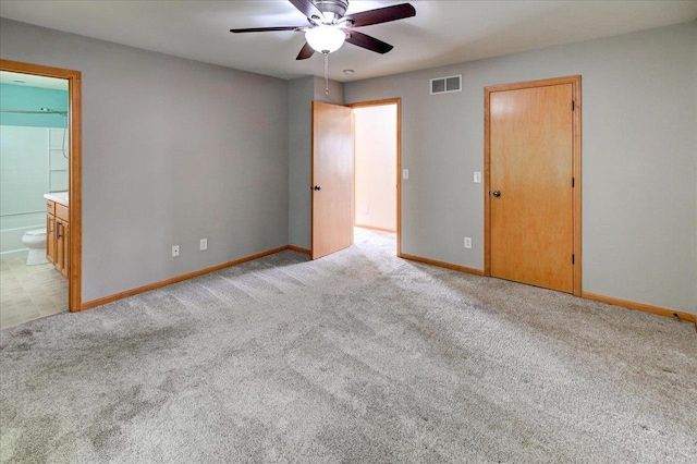 9305 Briar Haven Dr, Verona, WI 53593 - unfurnished bedroom with carpet flooring, baseboards, ensuite bathroom, and a ceiling fan