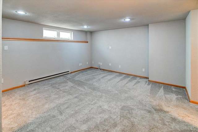 9305 Briar Haven Dr, Verona, WI 53593 - below grade area featuring a baseboard heating unit, carpet floors, baseboards, and recessed lighting