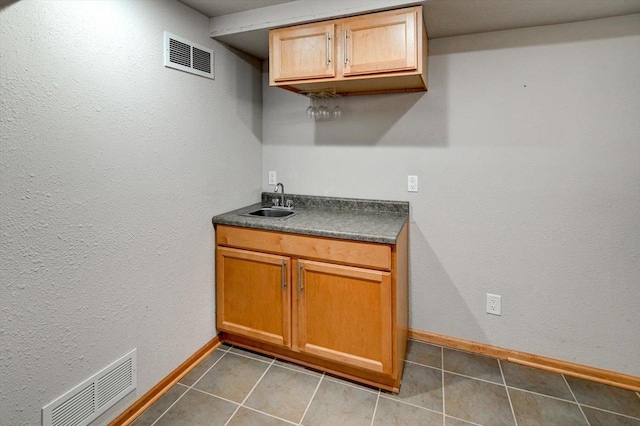 9305 Briar Haven Dr, Verona, WI 53593 - indoor wet bar with baseboards and tile patterned flooring