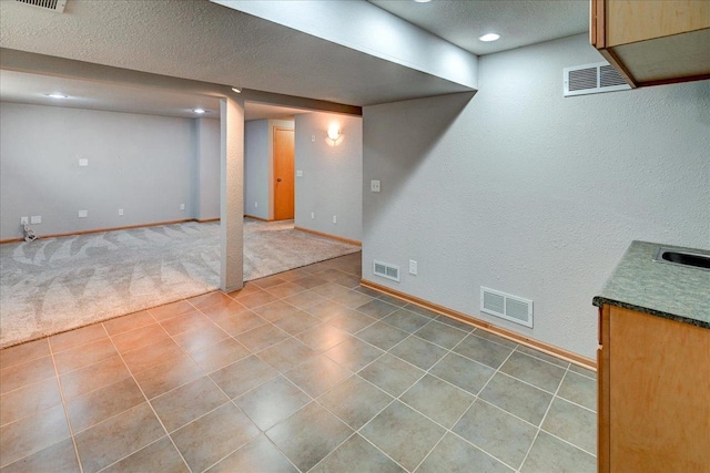9305 Briar Haven Dr, Verona, WI 53593 - finished basement with baseboards, a textured ceiling, and recessed lighting