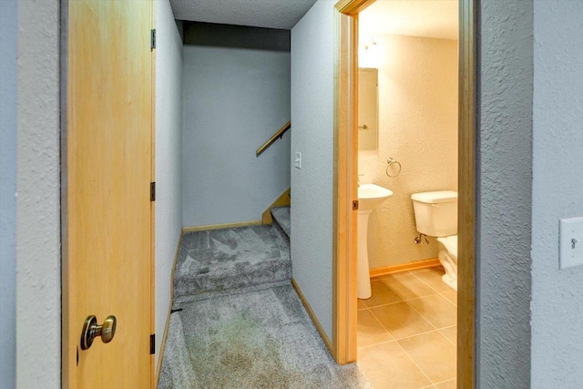 9305 Briar Haven Dr, Verona, WI 53593 - bathroom with toilet, a textured wall, tile patterned floors, and baseboards