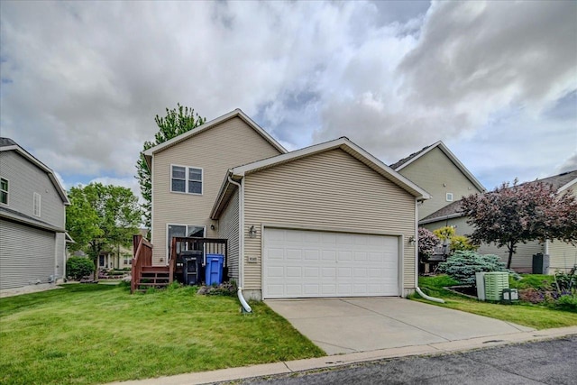 9305 Briar Haven Dr, Verona, WI 53593 - view of front of house featuring a garage, a front lawn, a deck, and concrete driveway
