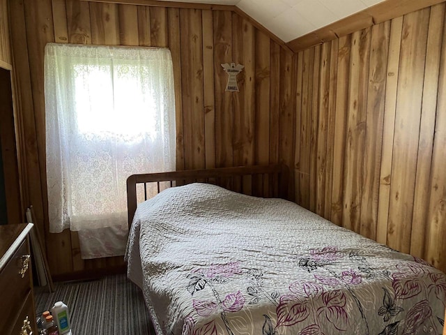 397 W Division St, Fond Du Lac, WI 54935 - bedroom with carpet flooring, wooden walls, and lofted ceiling