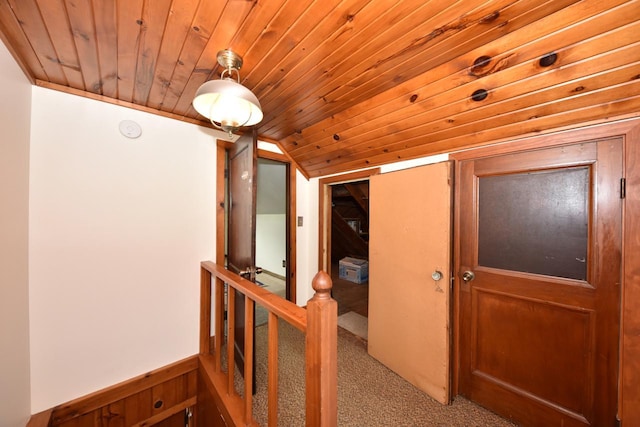 10339 W Hampton Ave, Milwaukee, WI 53225 - hall with an upstairs landing, lofted ceiling, wooden ceiling, carpet floors, and a wainscoted wall
