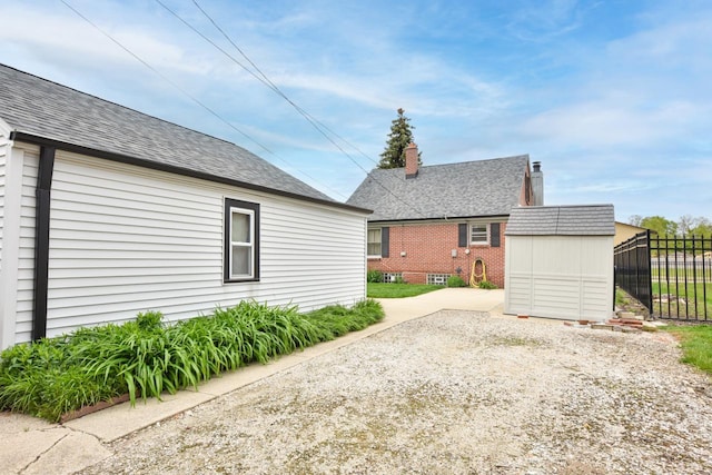 10339 W Hampton Ave, Milwaukee, WI 53225 - back of house with a shingled roof