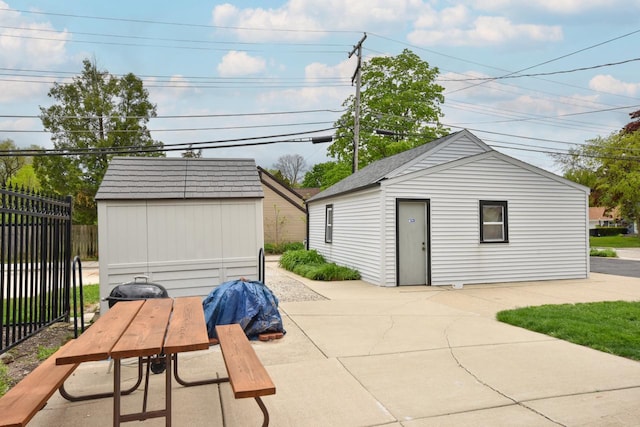 10339 W Hampton Ave, Milwaukee, WI 53225 - view of patio featuring an outdoor structure